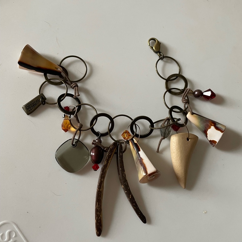 Charm bracelet with Swarovski charms , wooden beads and shell charms, antique